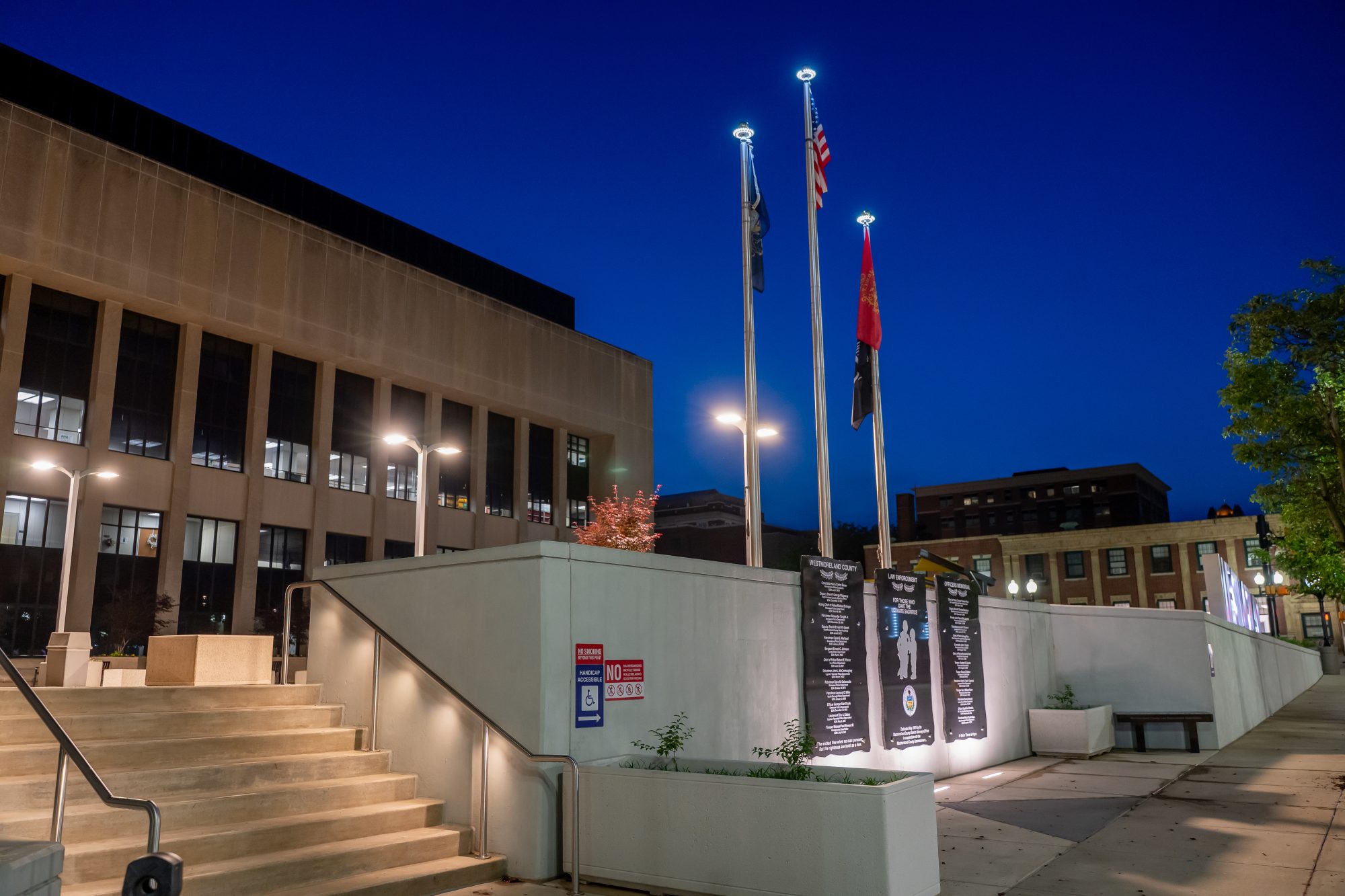 Evening shot of memorial and stair lighting designed by Design 3 Architecture 
